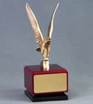 Image of a cast metal modern style eagle on a red square cube base